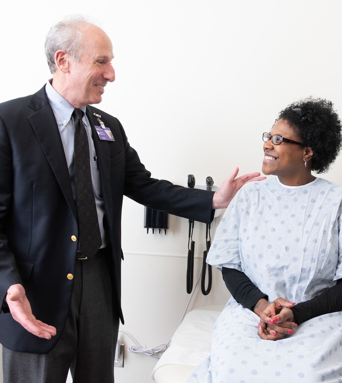 A woman talks to a health care professional.