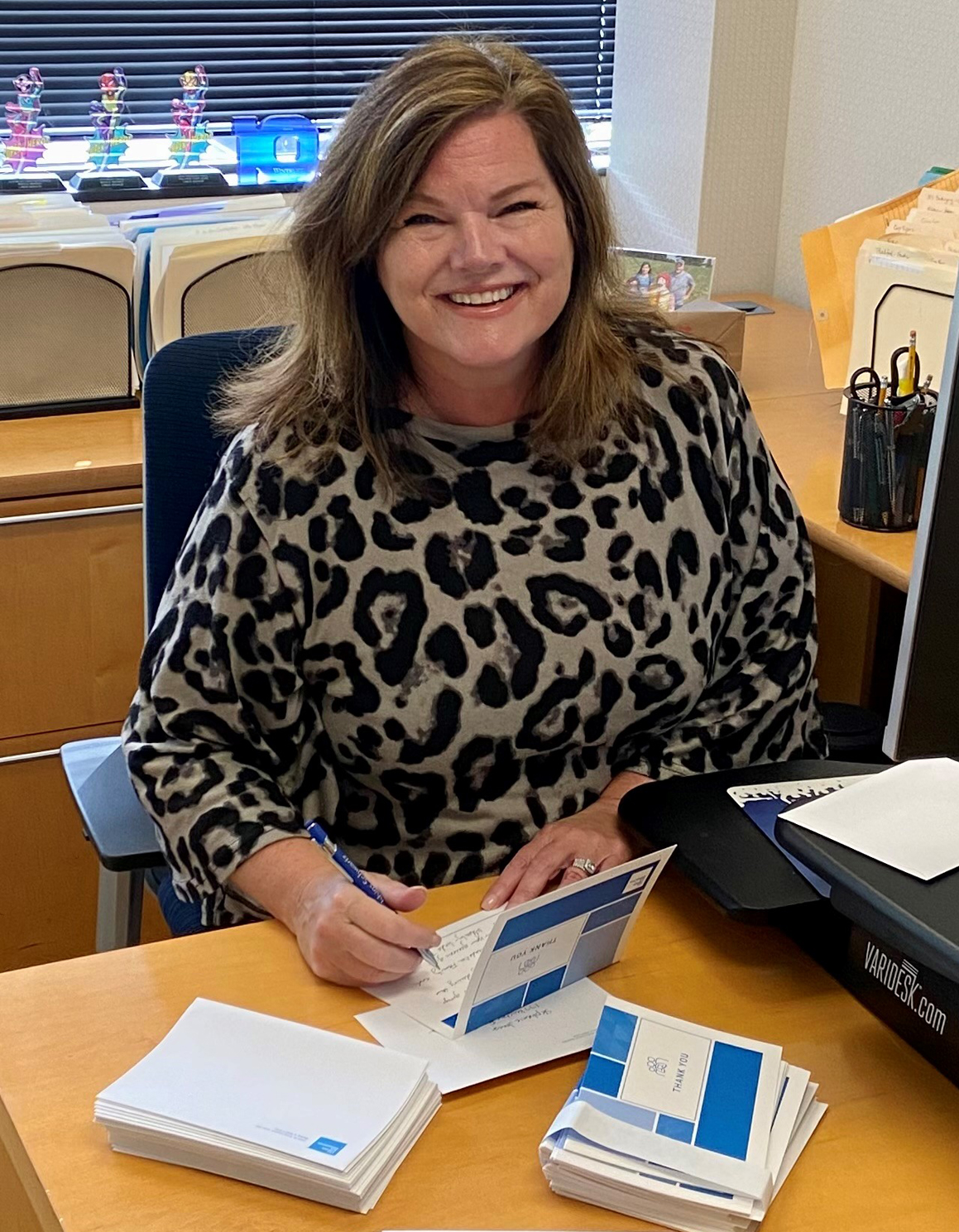 Gratitude Group member Linda Bishop writing letters.